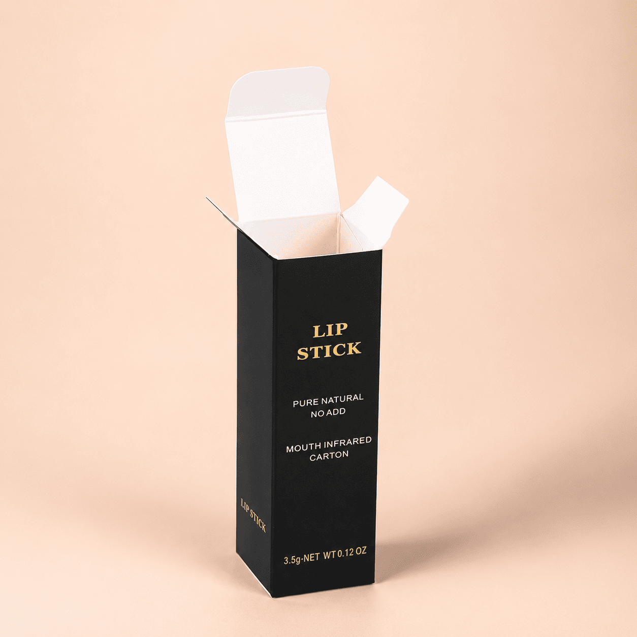 Foil stamped lipstick boxes in matte black card stock with a gold foil logo for a natural lip brand