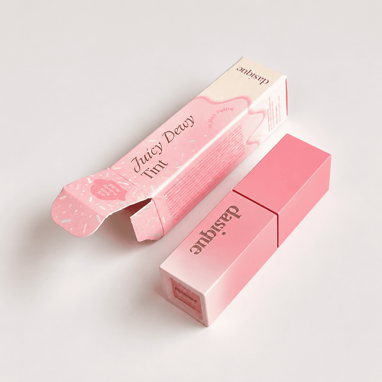 Printed lipstick boxes in pink with an all-over sprinkle pattern and a printed interior for a playful lip tint brand