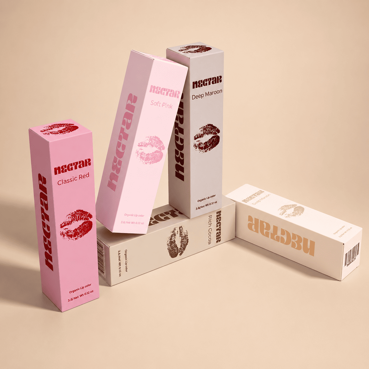 Wholesale lipstick boxes color-coded across a full shade range with a kiss-print motif for private-label lip brands