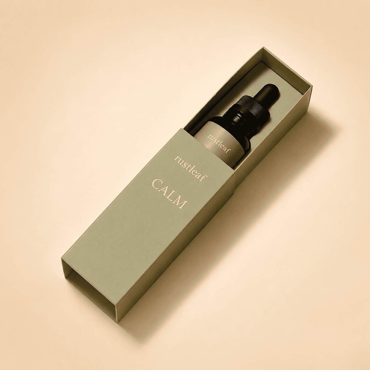 Personalized serum boxes with a sliding drawer and a dropper bottle nestled in the muted olive tray